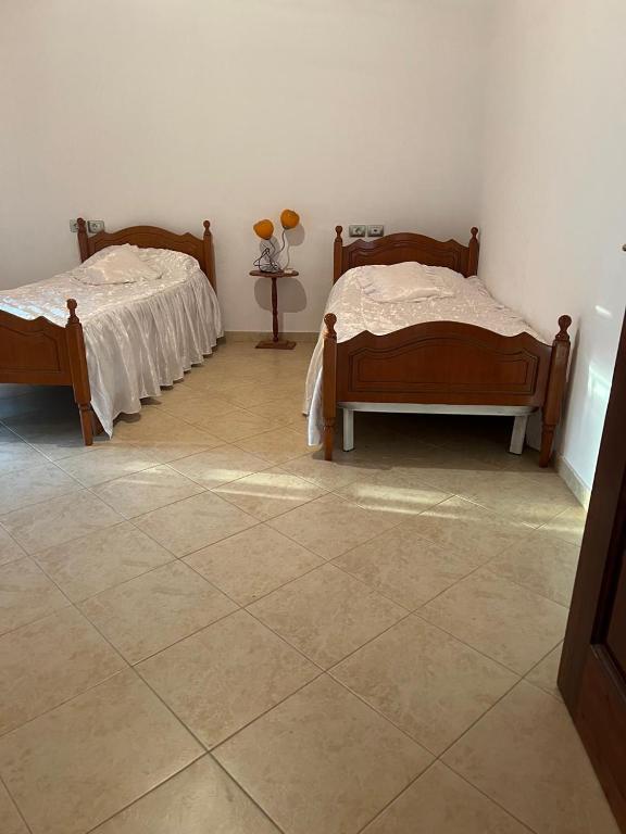 Postel nebo postele na pokoji v ubytování Nori House