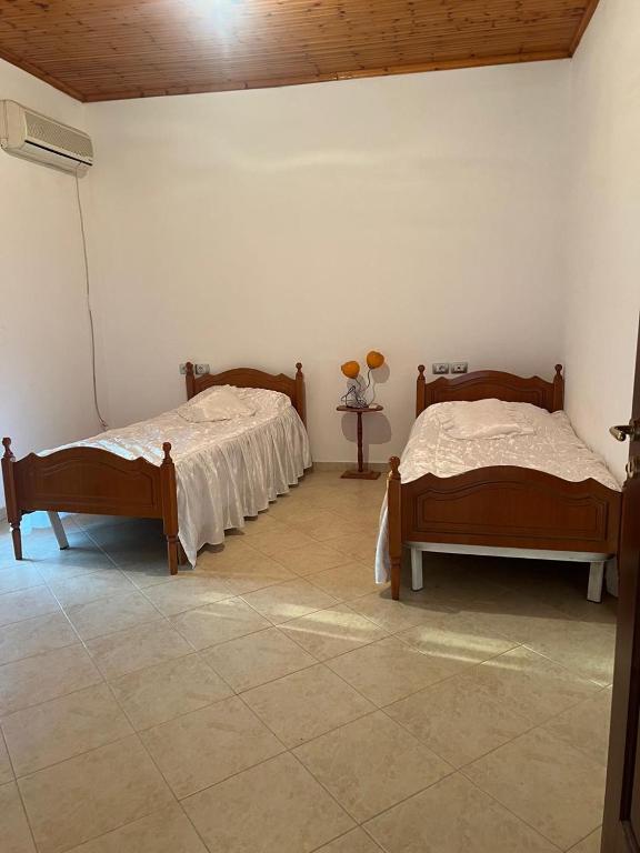 Postel nebo postele na pokoji v ubytování Nori House