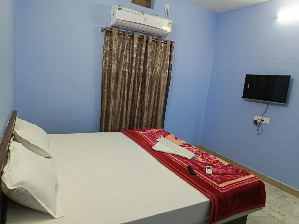 Postel nebo postele na pokoji v ubytování Hotel Siddhi
