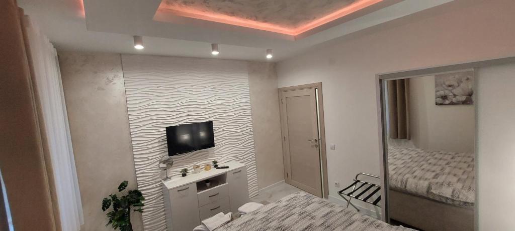 TV a/nebo společenská místnost v ubytování GOLD APARTMANI