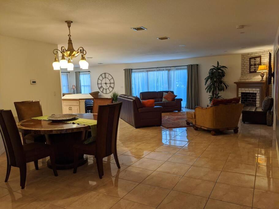 a dining room and living room with a table and chairs at Spacious House in Fort Lauderdale - Minutes from Beach in Fort Lauderdale