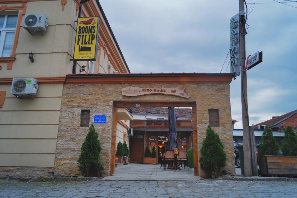 a building with an entrance to a restaurant at Rooms Filip in Bitola