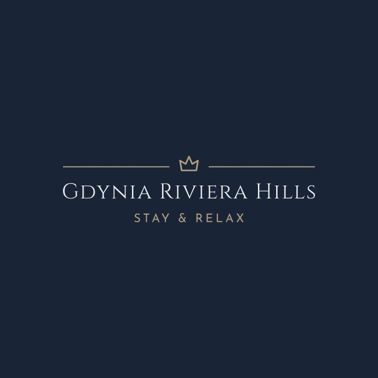 a logo for a hotel with a crown on it at Gdynia Riviera Hills in Gdynia