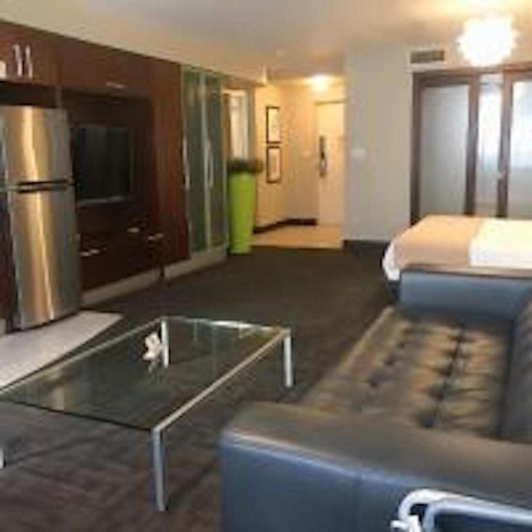 a hotel room with a couch and a coffee table at Congress Ocean Drive in Miami Beach