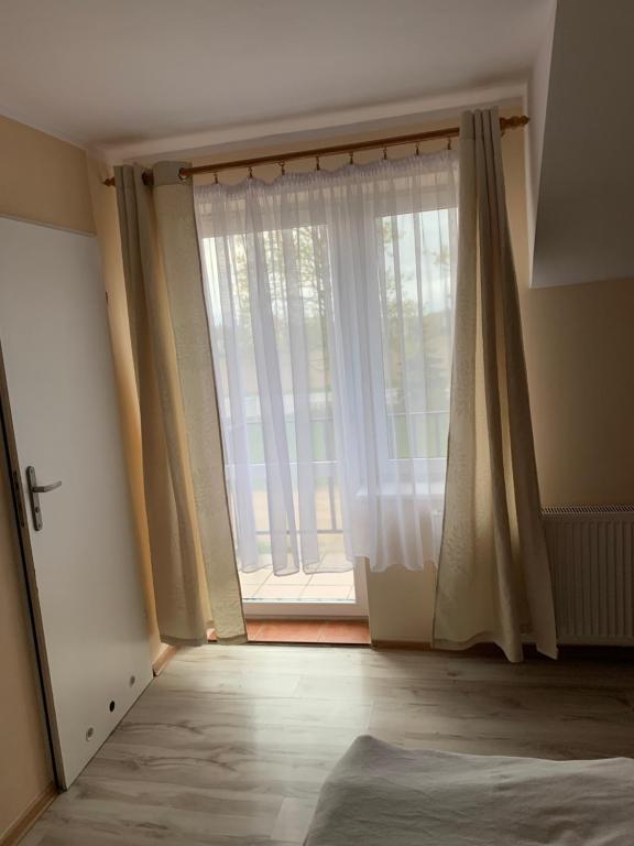 Postel nebo postele na pokoji v ubytování Kaszub Swarzewo - Bed & Breakfast