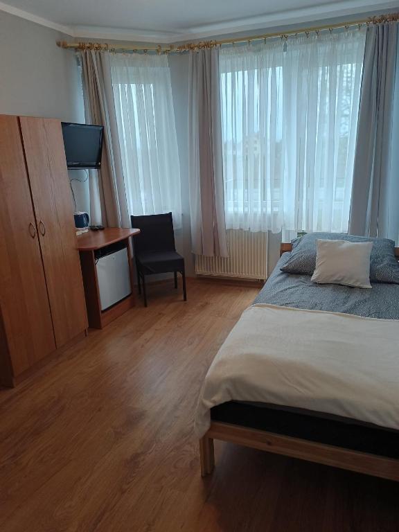 Postel nebo postele na pokoji v ubytování Kaszub Swarzewo - Bed & Breakfast