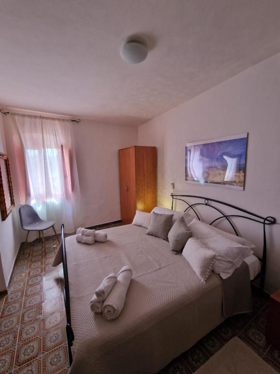 Postel nebo postele na pokoji v ubytování Mammaioa house