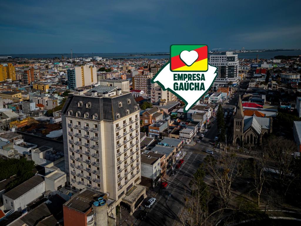 a tall building with a sign that reads embassy embassy chicago at Hotel Laghetto Villa Moura in Rio Grande