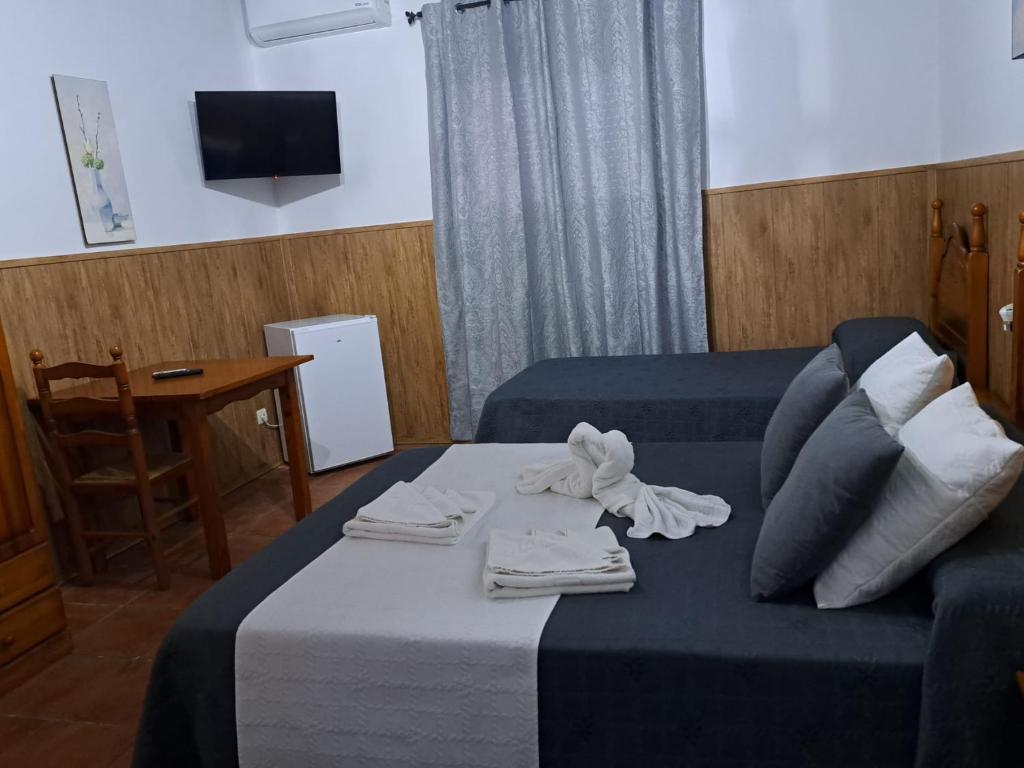 Postel nebo postele na pokoji v ubytování Hostal Breñaverde