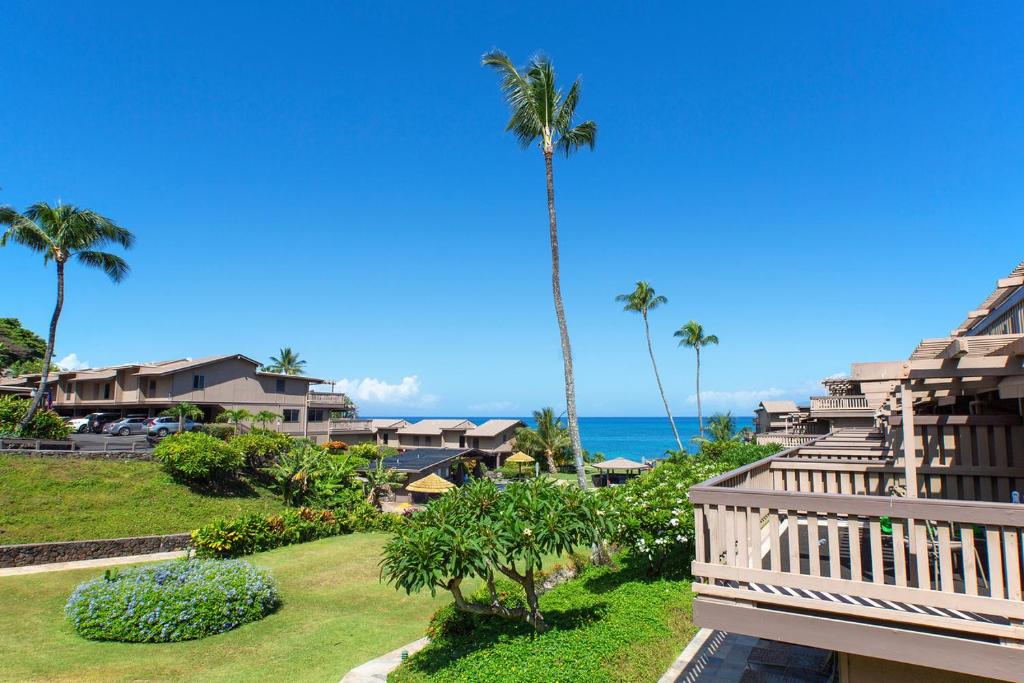 a view of the ocean from the balcony of a resort at Oceanfront & ac! ks d9 - Sullivan Properties in Kahana