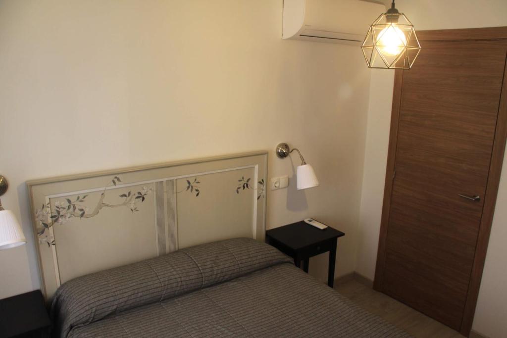 En eller flere senger på et rom på Madrid Rent 2