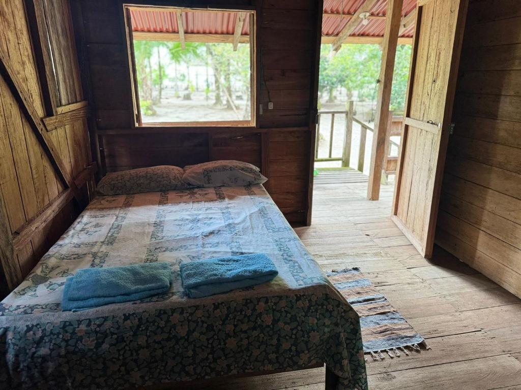 Postel nebo postele na pokoji v ubytování HOSPEDAJE DOÑA NEL