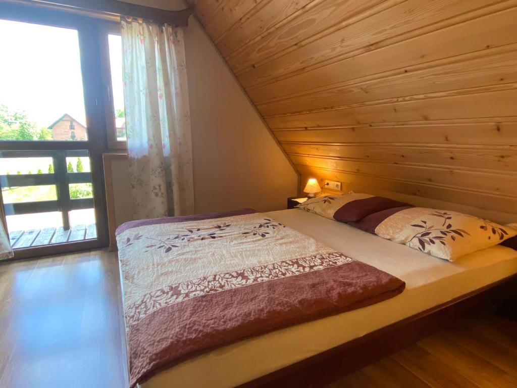Posteľ alebo postele v izbe v ubytovaní Jakubowy Domek
