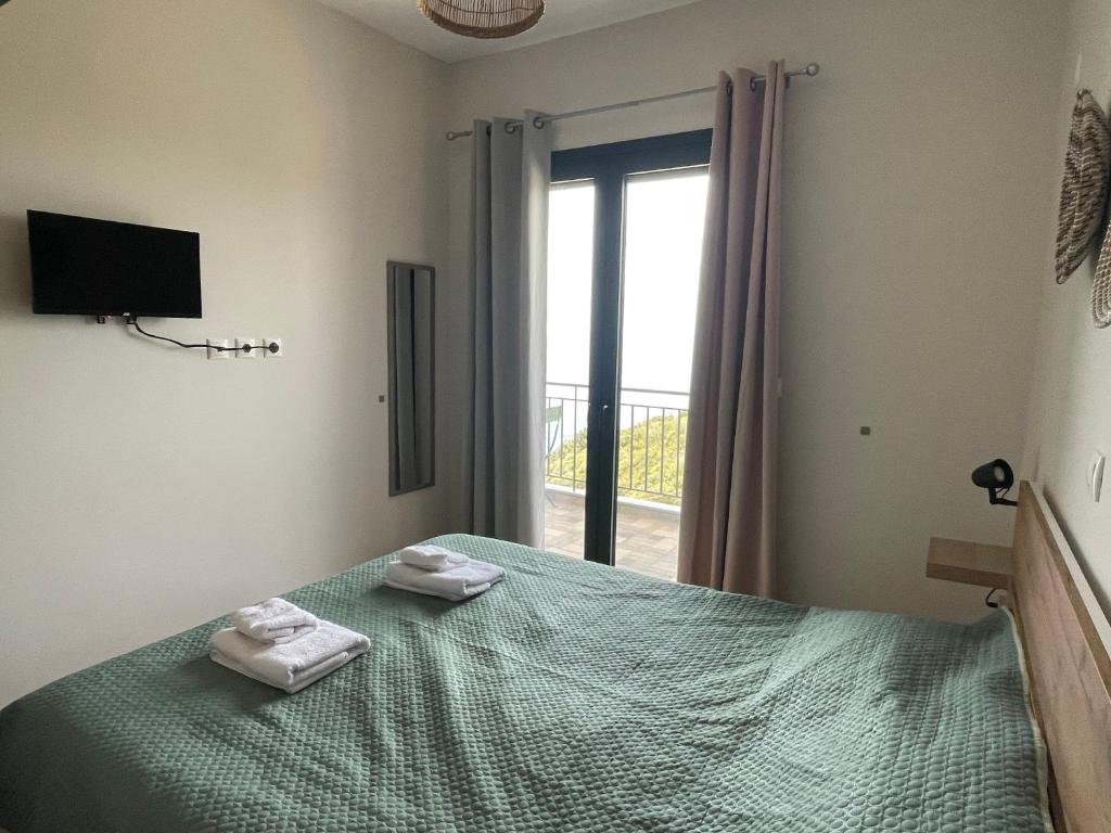 Postel nebo postele na pokoji v ubytování Loris’House
