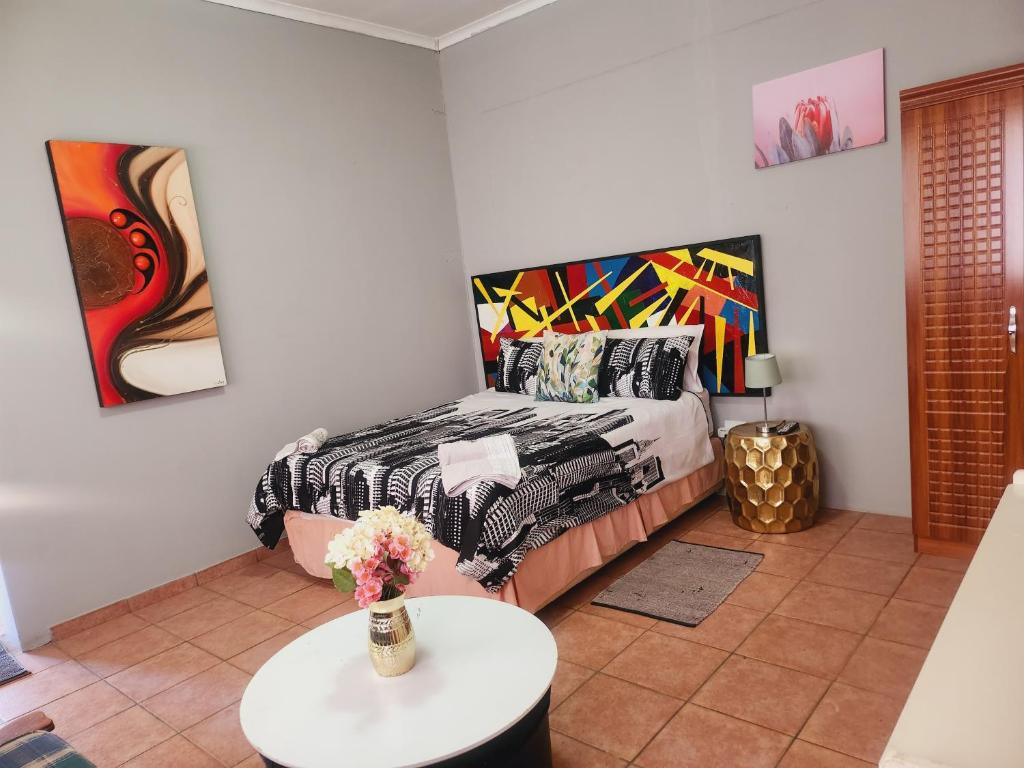 En eller flere senge i et værelse på Kuntuala House