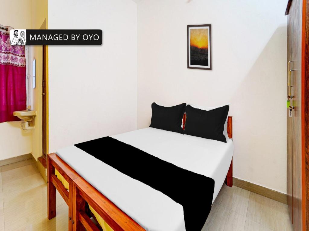 Tempat tidur dalam kamar di OYO Okkilipalayam