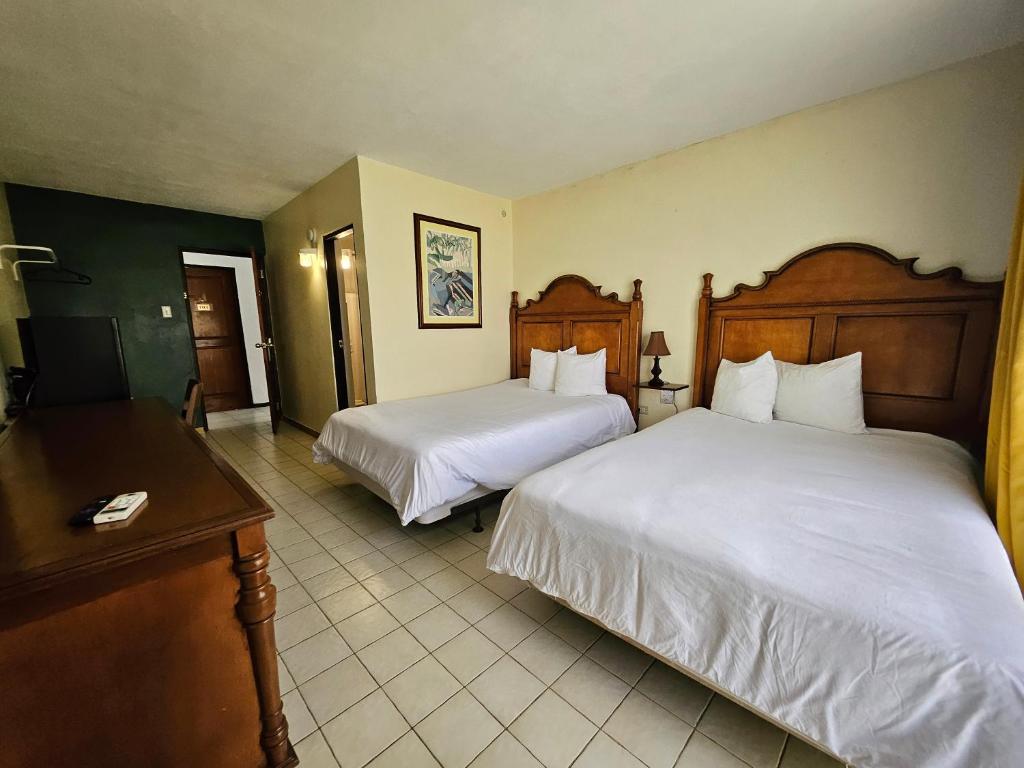Cama o camas de una habitación en Selva Boutique Hotel - Luquillo Oceanfront Retreat - Adults Only