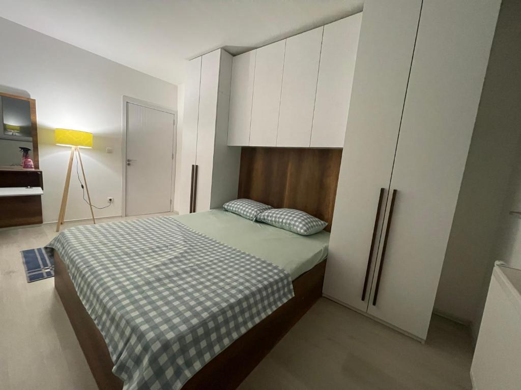 Ένα ή περισσότερα κρεβάτια σε δωμάτιο στο Ardi Apartments