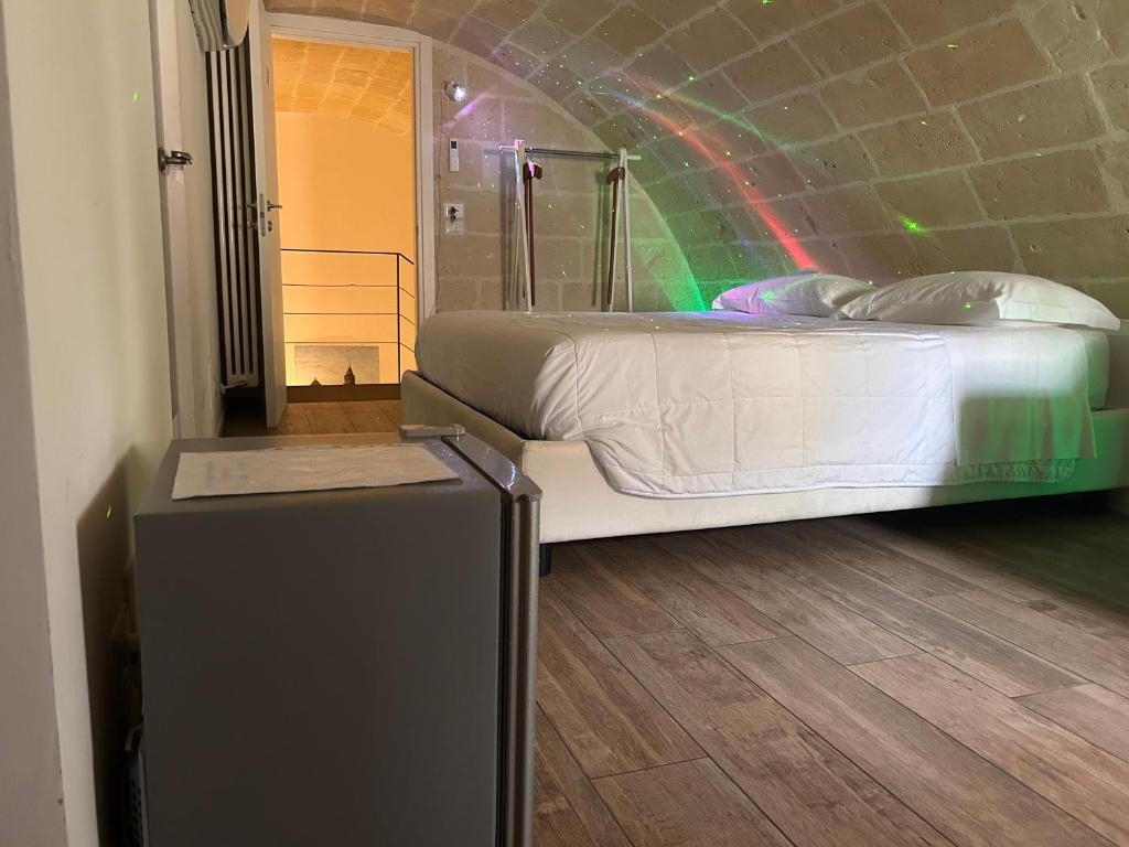 Postel nebo postele na pokoji v ubytování Recinto antico Sweet Rooms
