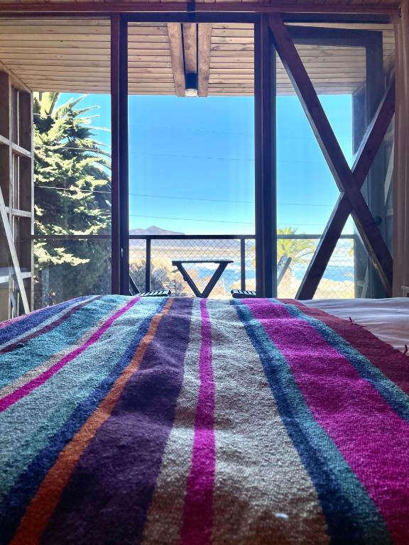 Postel nebo postele na pokoji v ubytování La Ritoqueña Hotel de Playa