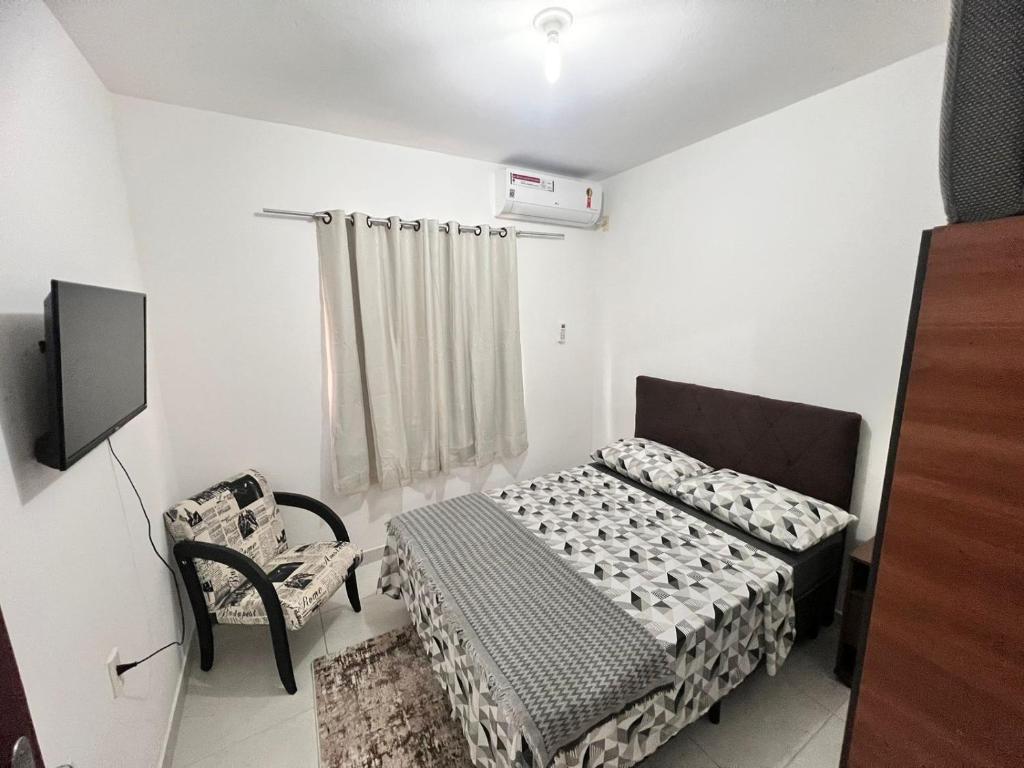 Gulta vai gultas numurā naktsmītnē Apartamento em Florianópolis Próximo ao Aeroporto