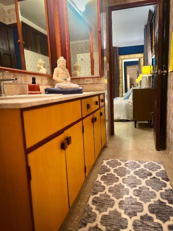 a bathroom with a sink and a mirror at ORHO HOTEL BOUTIQUE PANAMA Tocumen Airport free shuttle highway round trip 15 minuts in Tocumen