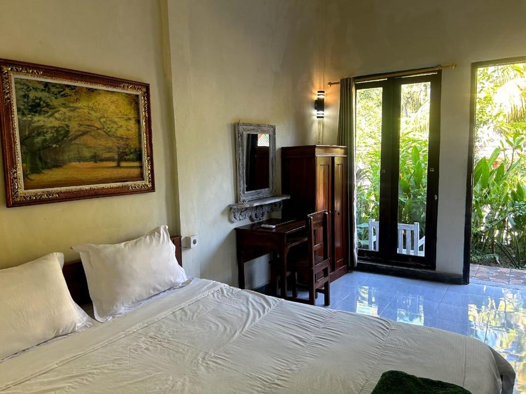 Ένα ή περισσότερα κρεβάτια σε δωμάτιο στο Citronella Homestay Nusa Penida
