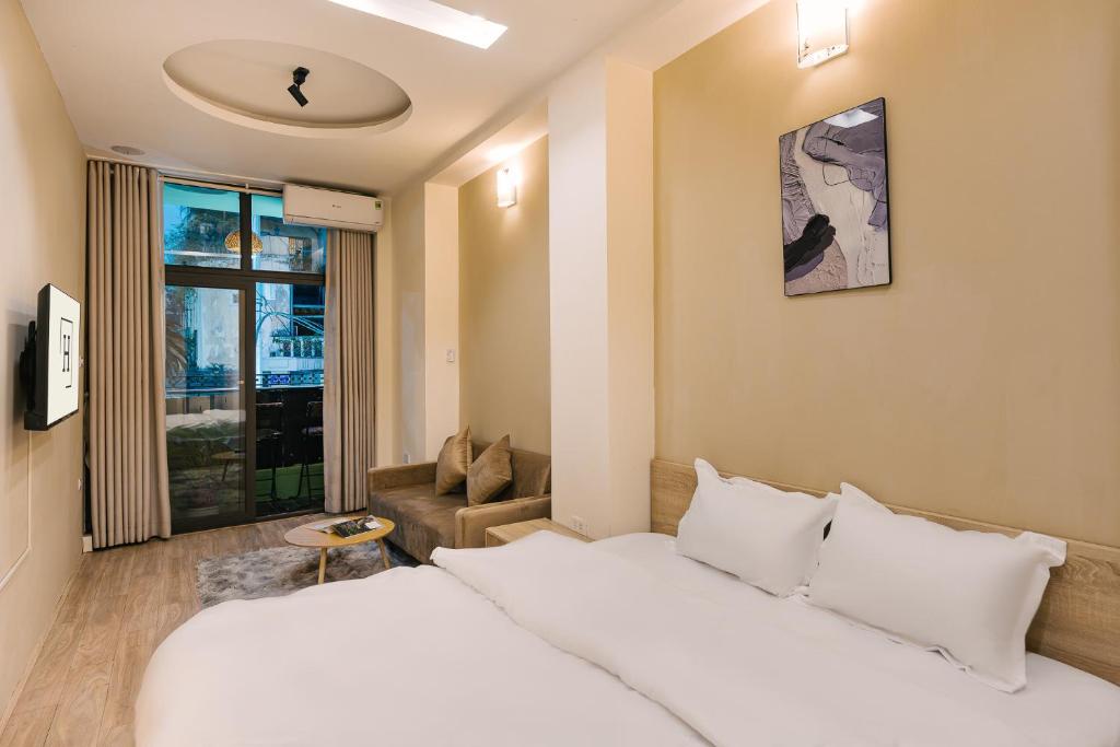 Postel nebo postele na pokoji v ubytování Hanoi-Oi Homestay Cau Go