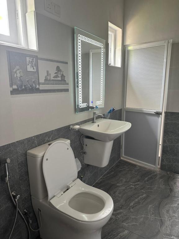 Koupelna v ubytování Kande Home