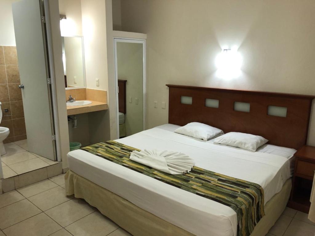 Postel nebo postele na pokoji v ubytování Hotel Xcalak