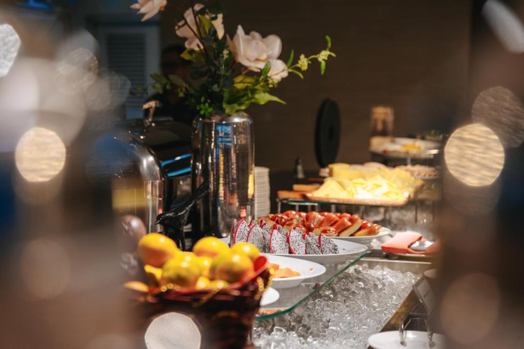 A close-up view of a chilled fruit and dessert section at the breakfast buffet.