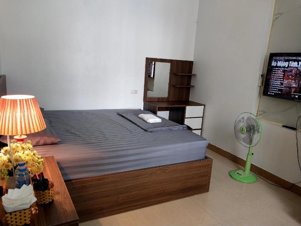 Postel nebo postele na pokoji v ubytování Nha Xanh Homestay