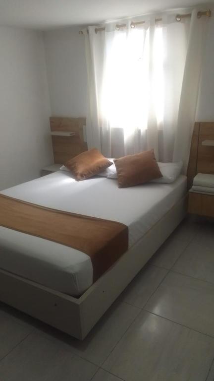 Postel nebo postele na pokoji v ubytování Hotel Gutier Rionegro