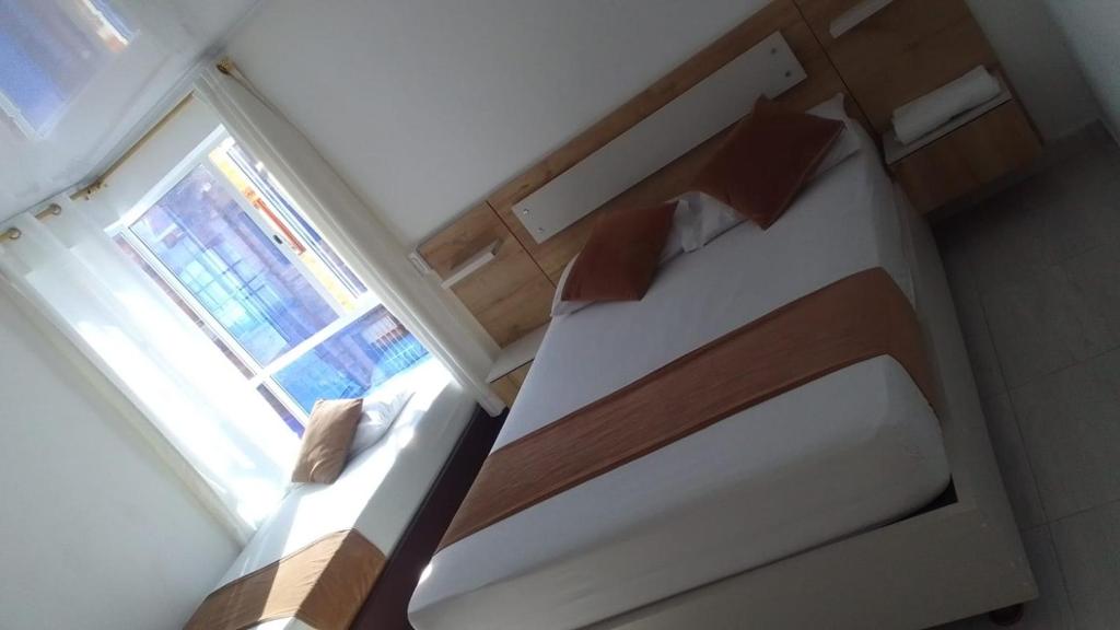 Postel nebo postele na pokoji v ubytování Hotel Gutier Rionegro
