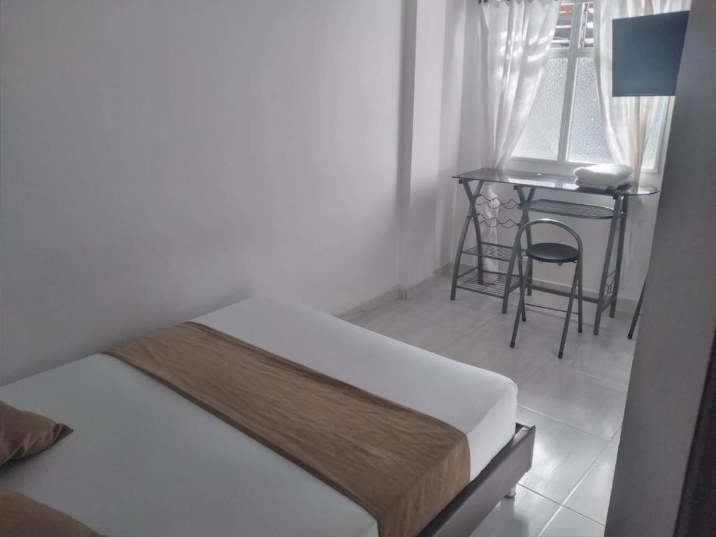 Postel nebo postele na pokoji v ubytování Hotel Gutier Rionegro