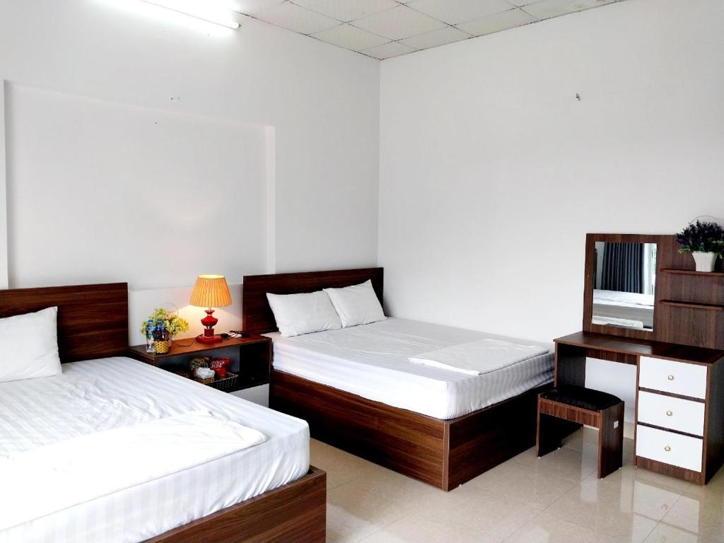 Postel nebo postele na pokoji v ubytování Nha Xanh Homestay