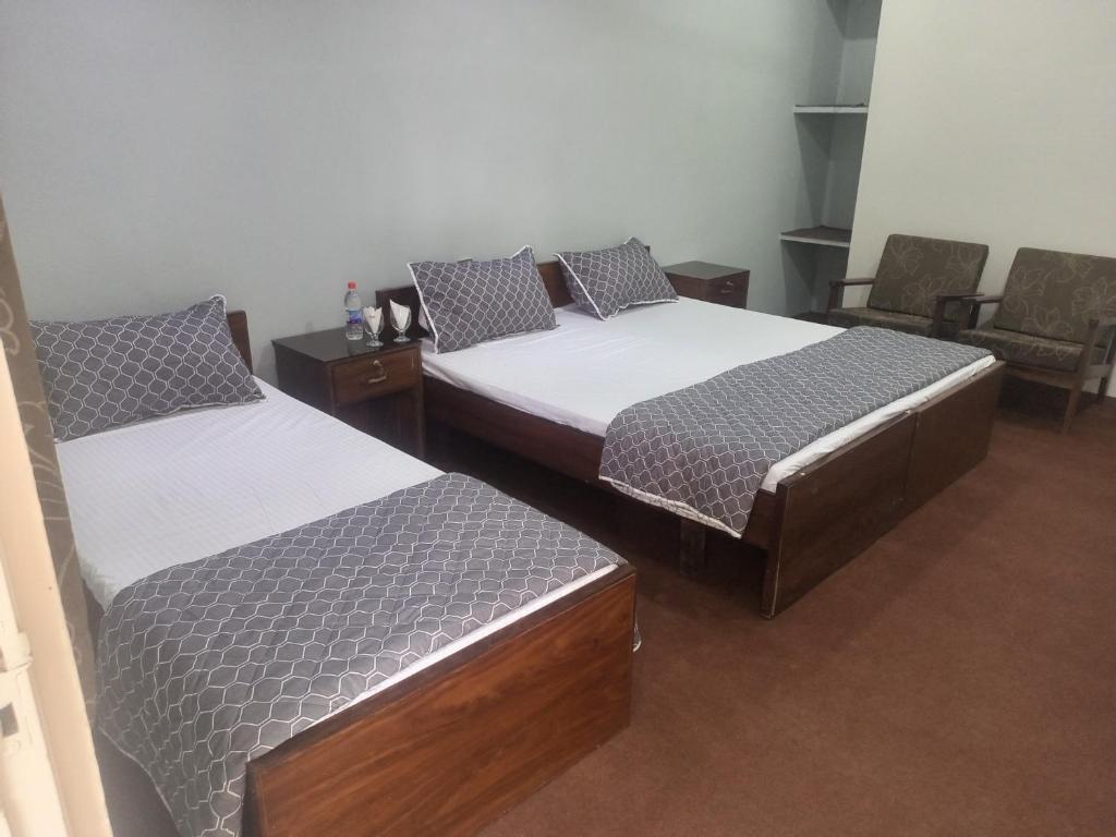 Un ou plusieurs lits dans un hébergement de l'établissement Palms View Hotel