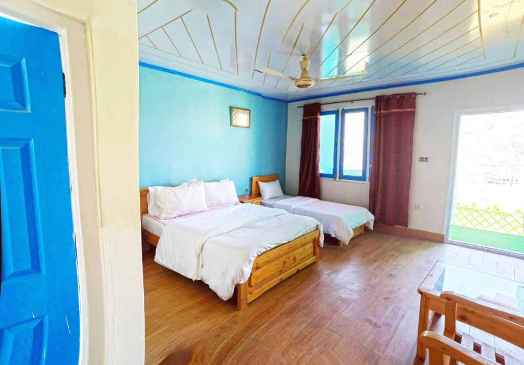 Voodi või voodid majutusasutuse Hotel Mountain Lodge Skardu toas