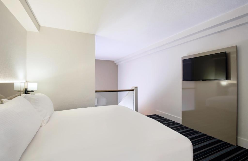Voodi või voodid majutusasutuse DoubleTree by Hilton Esplanade Darwin toas