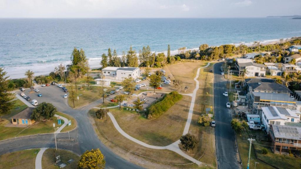 an aerial view of a town with the ocean at Sea Breeze in Old Bar