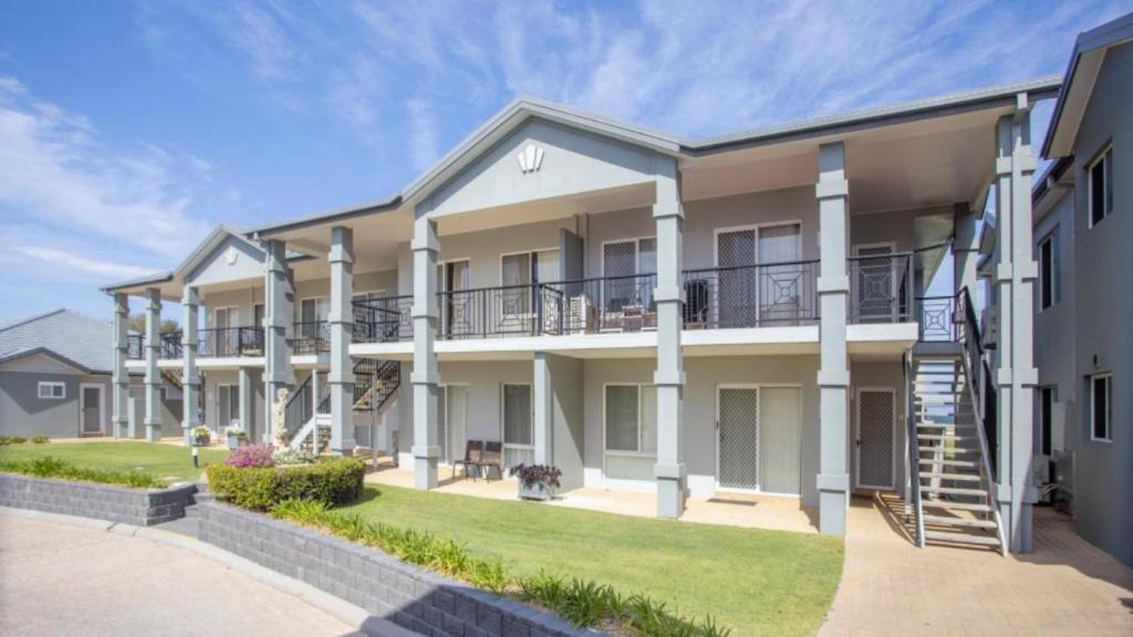 an exterior view of a large apartment building at Apartment 14 - The Meridian in Old Bar