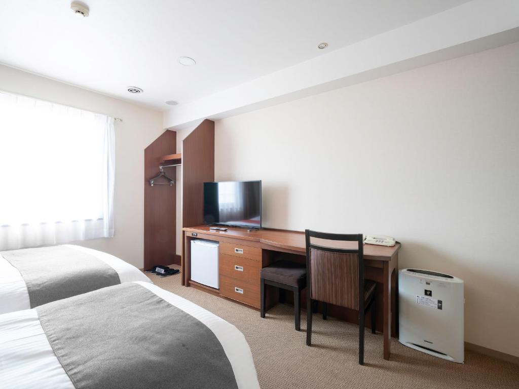 Postel nebo postele na pokoji v ubytování Vessel Hotel Kanda Kitakyushu Airport