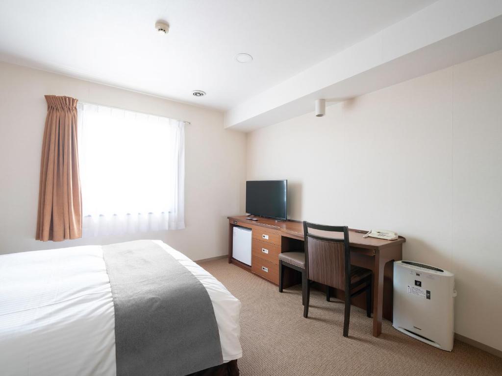 TV a/nebo společenská místnost v ubytování Vessel Hotel Kanda Kitakyushu Airport