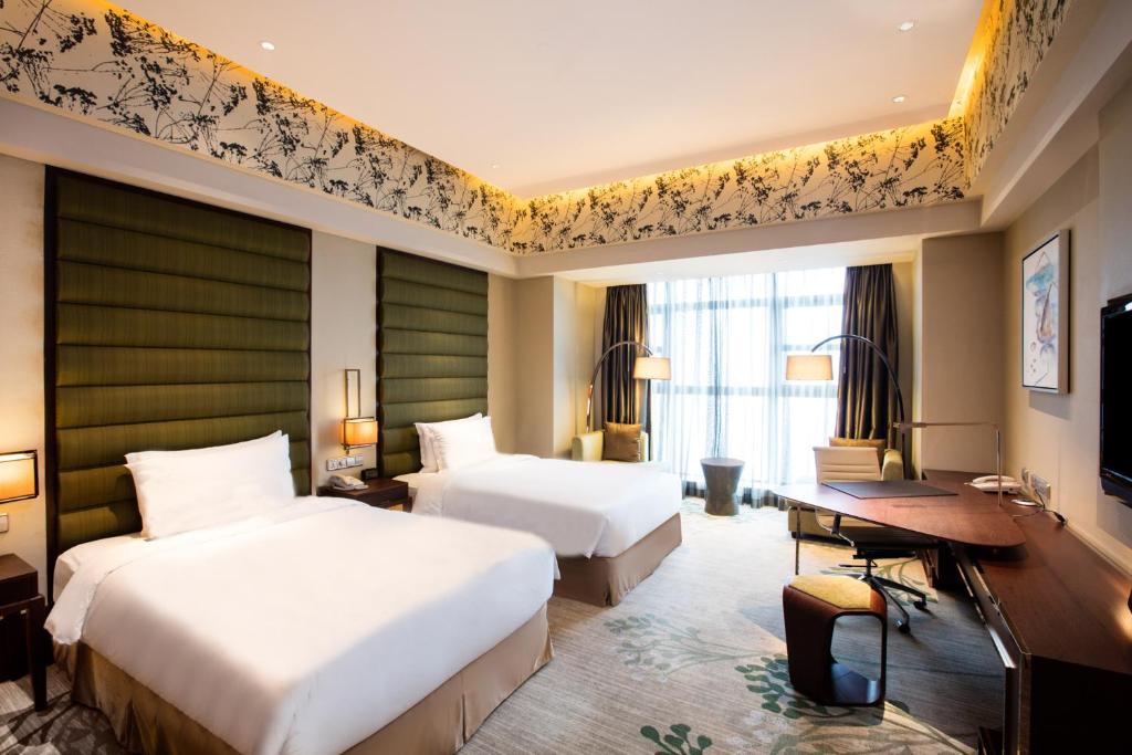 Postel nebo postele na pokoji v ubytování Crowne Plaza Hefei by IHG