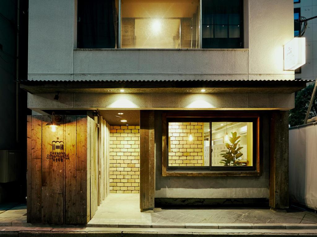 a building with a door and a window at Akasaka Guesthouse HIVE in Tokyo