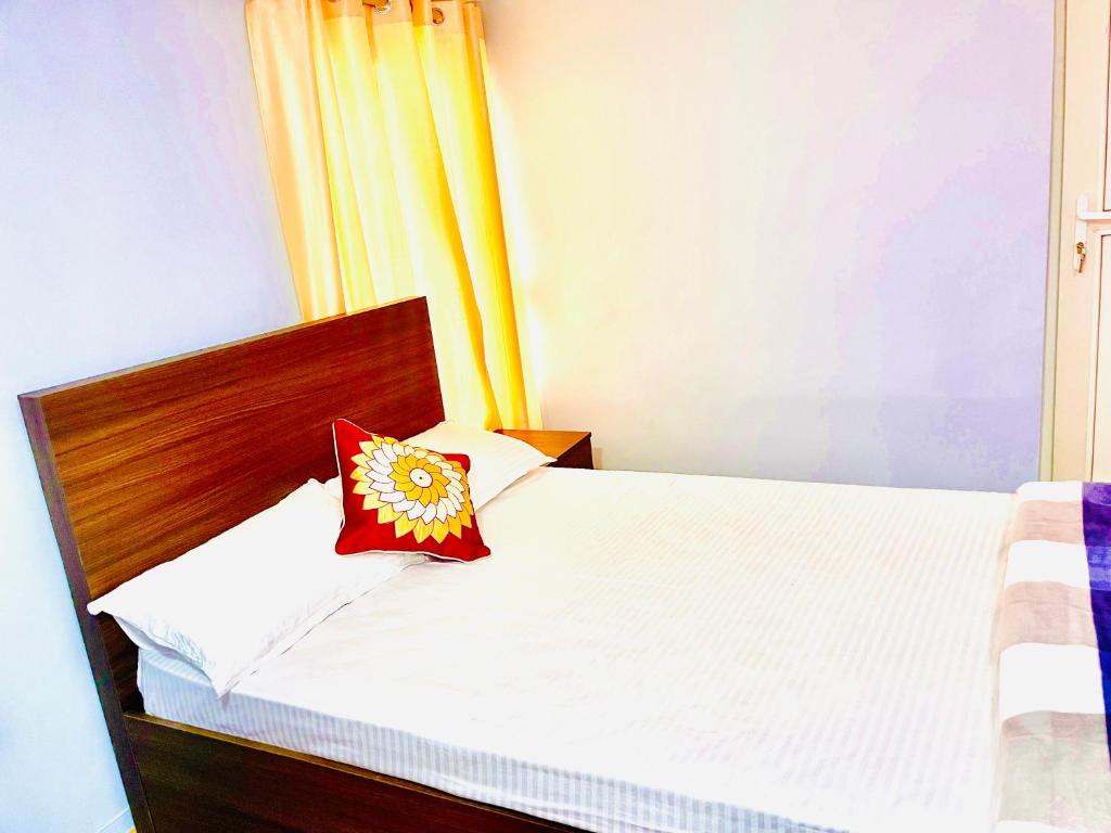 Postel nebo postele na pokoji v ubytování Arusiya Apartment