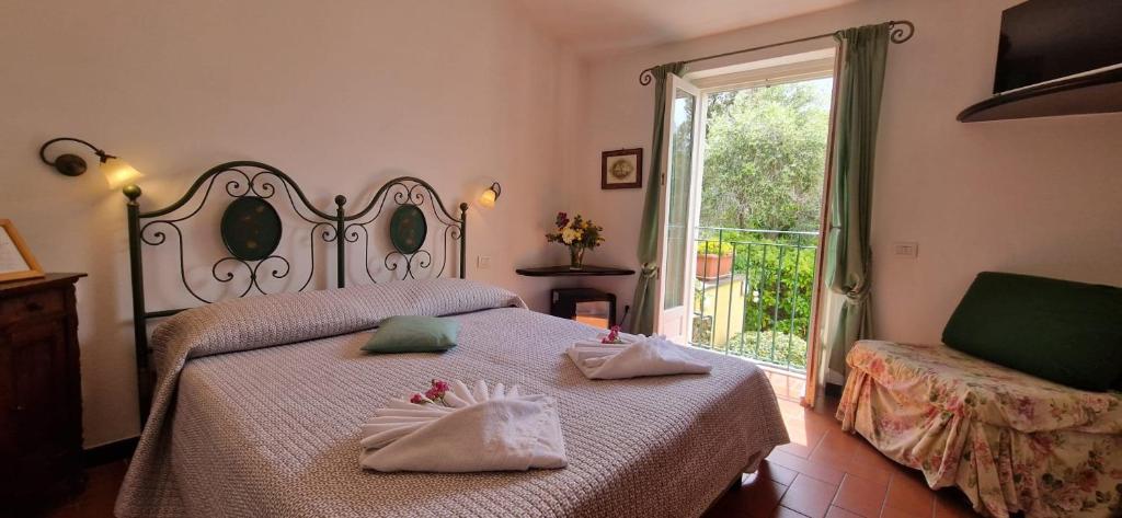 Postel nebo postele na pokoji v ubytování Hotel La Giada del Mesco