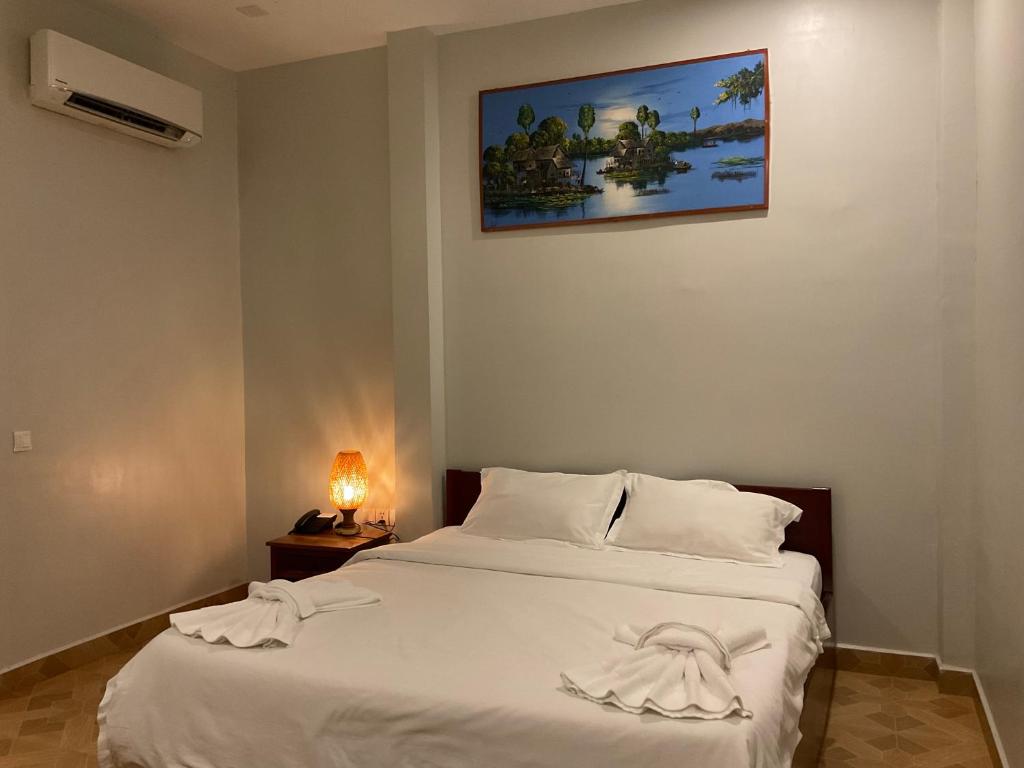 Postel nebo postele na pokoji v ubytování Nico's Hotel 2