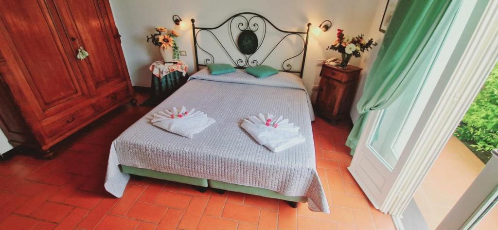 Postel nebo postele na pokoji v ubytování Hotel La Giada del Mesco
