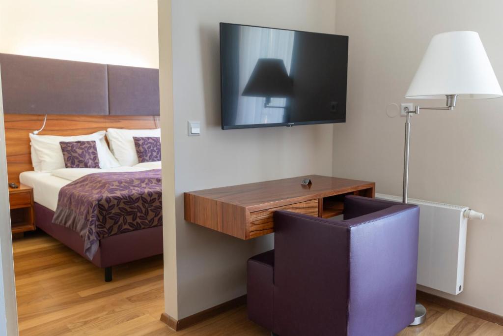 Postel nebo postele na pokoji v ubytování Pakat Suites